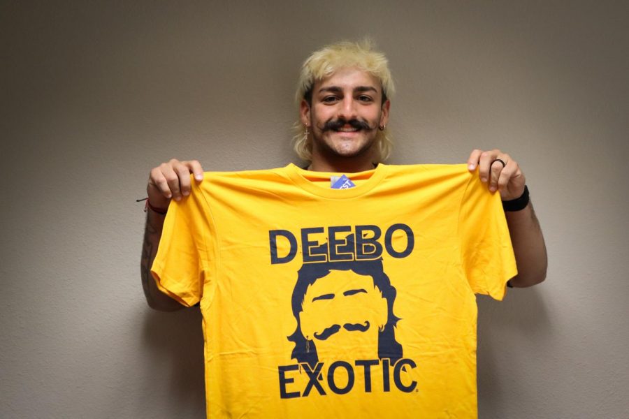 Derien Beauregard, known by many as Deebo, poses with a RAYGUN shirt created after his Twitter fame.
