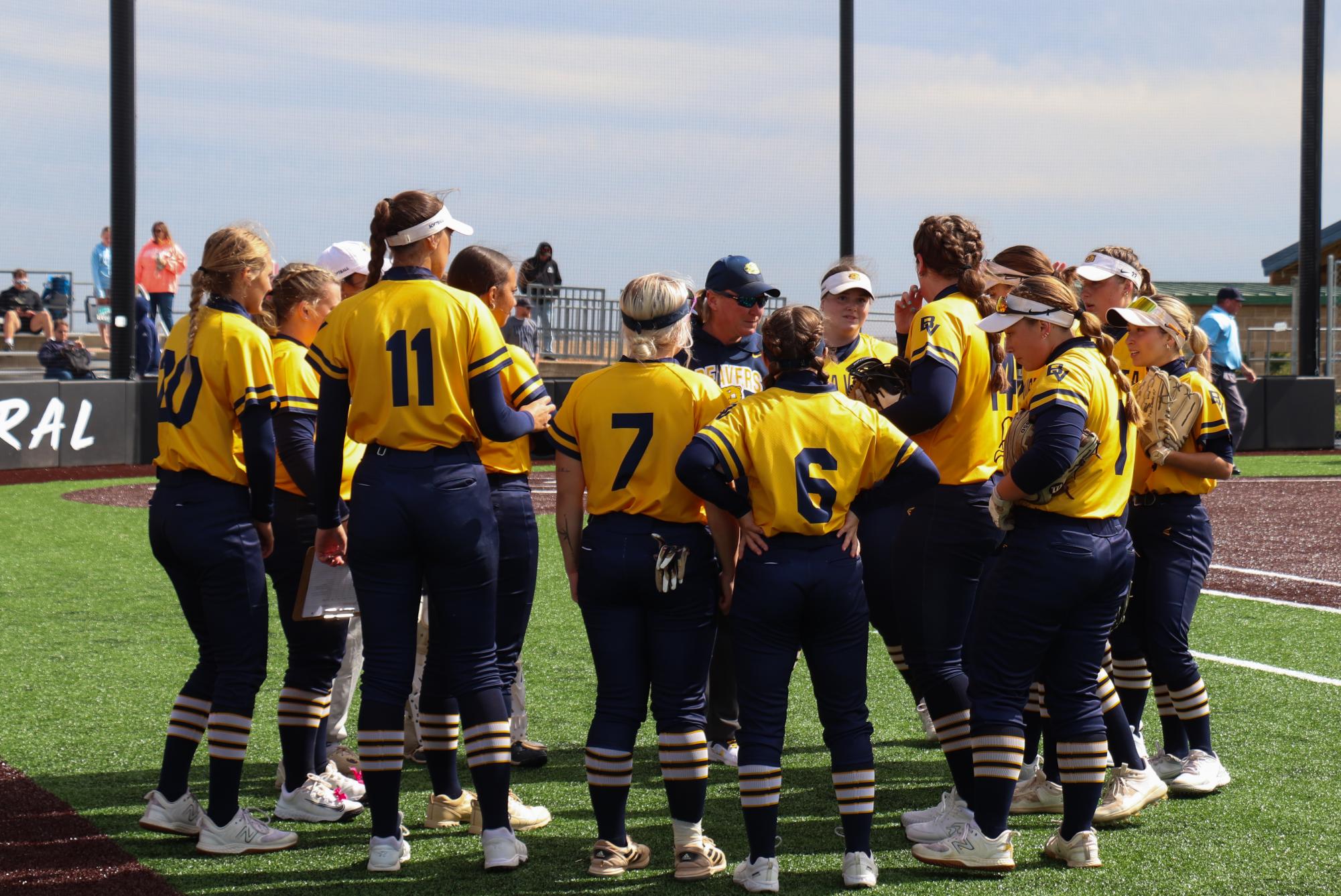 Team huddle after the first inning. 