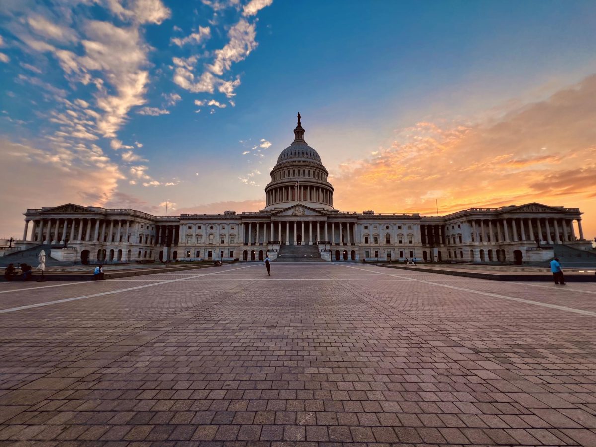 The sun sets down behind the Capitol Building after a perfect day. 