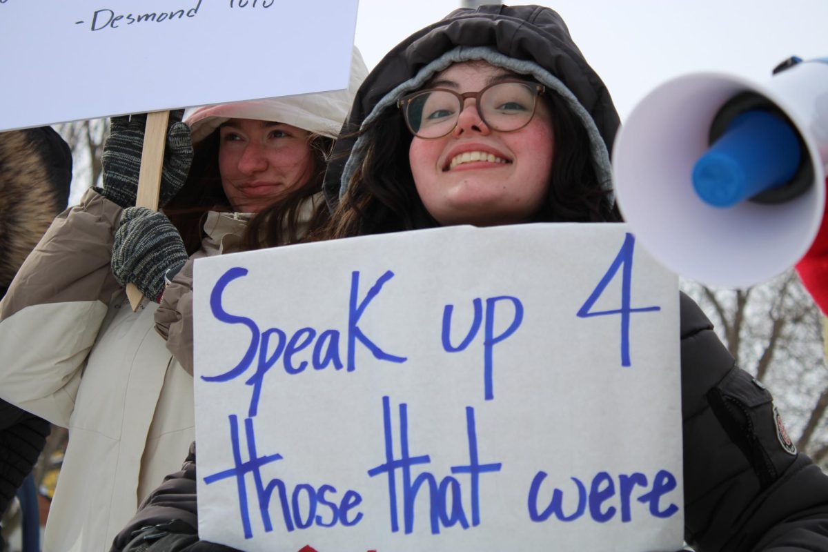 Holding signs with a megaphone