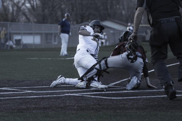 A BVU player slides home