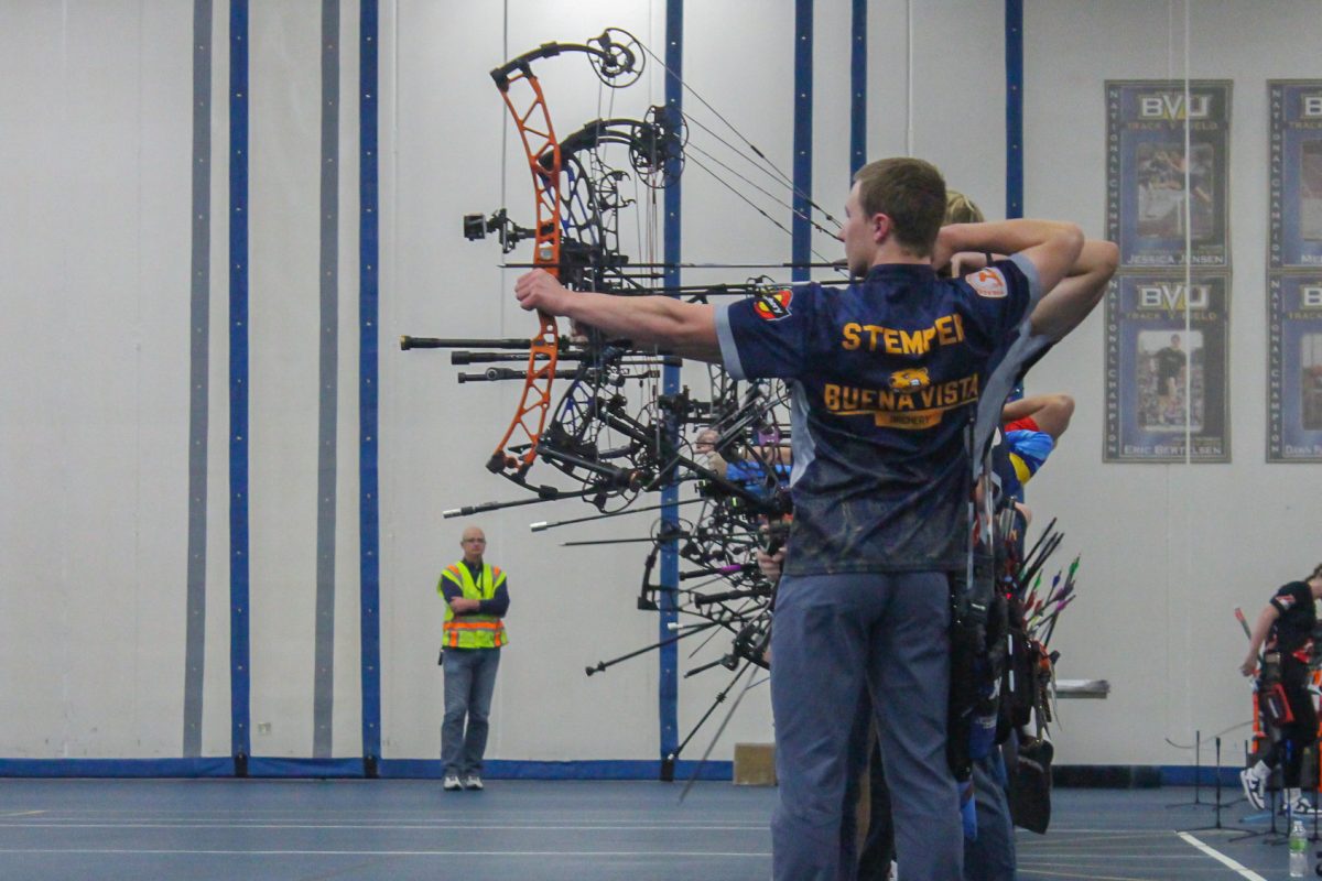 Sophomore Ethan Stemper stands at the end of the row as they take aim.