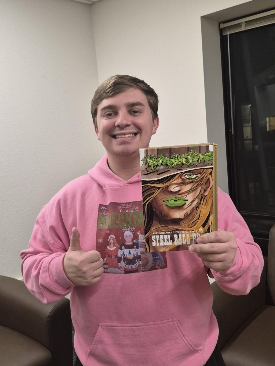 Micah Garringer with the first volume of "JoJo’s Bizarre Adventure Part 7."