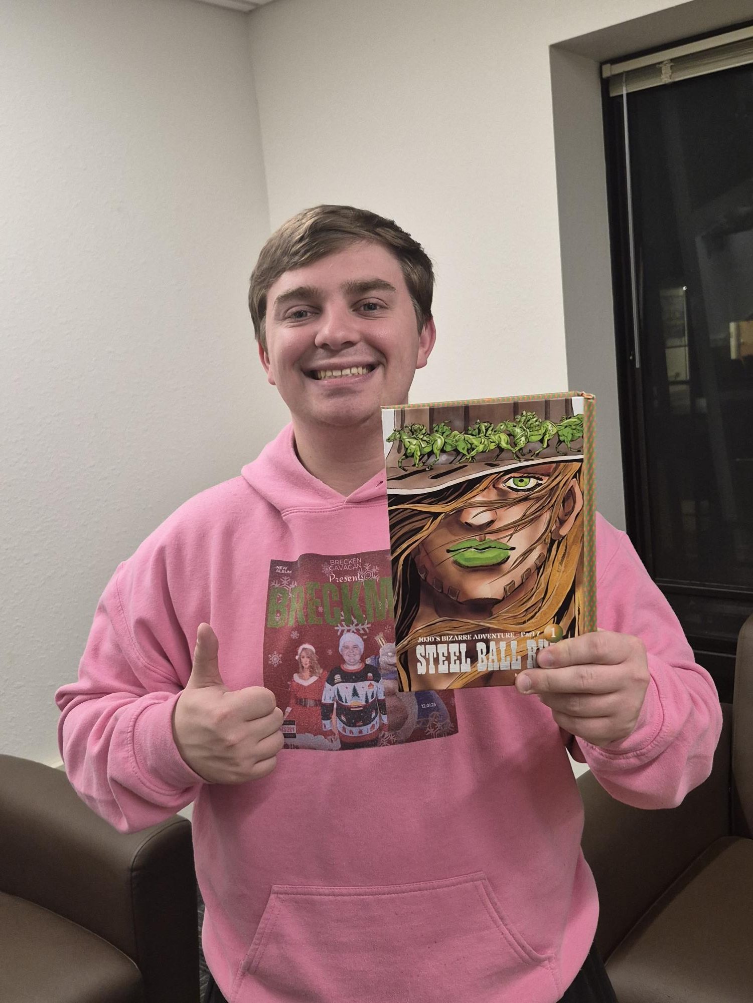 Micah Garringer with the first volume of "JoJo’s Bizarre Adventure Part 7."