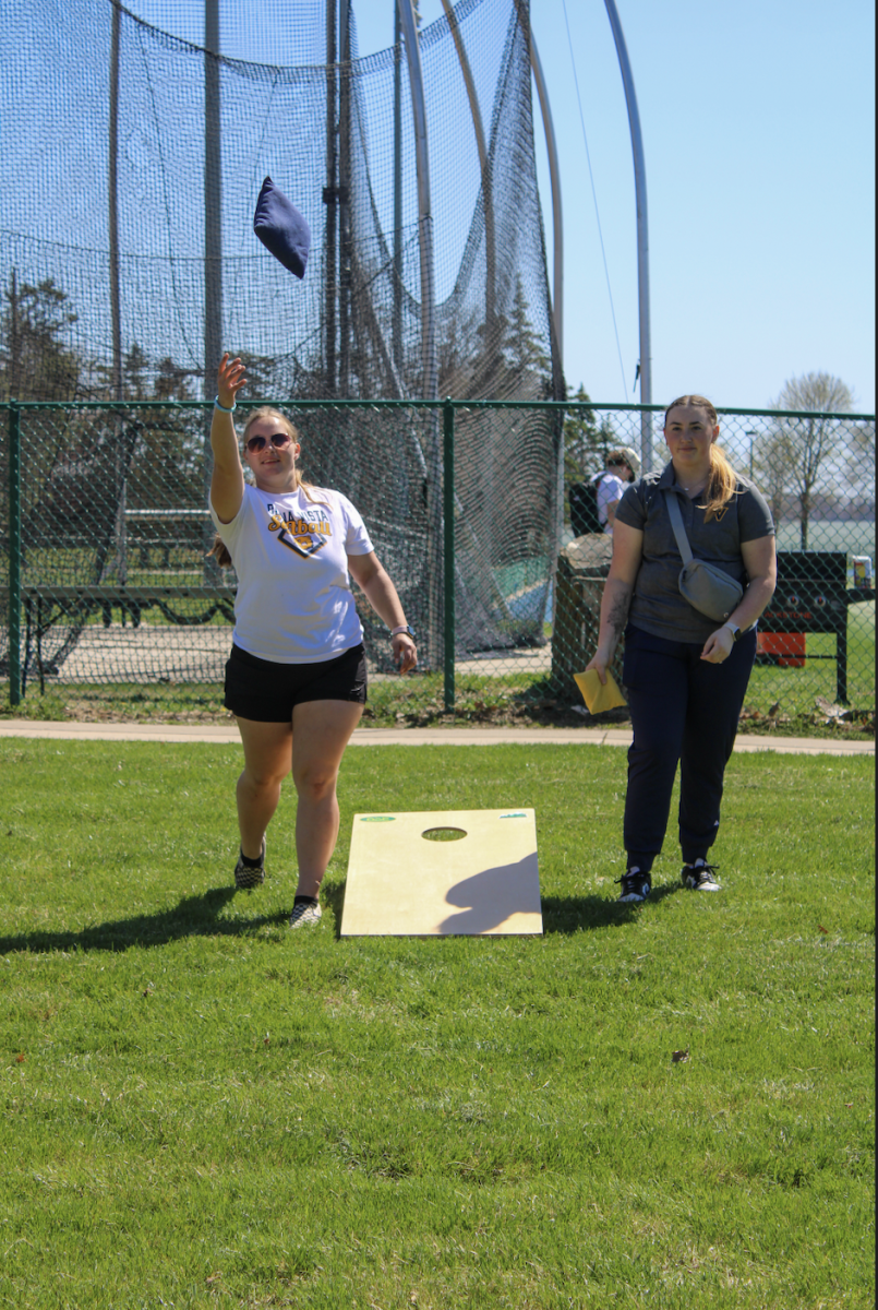Geneva Galler, left, plays cornhole with Madison Lindaman on Thursday, April 16, 2026.