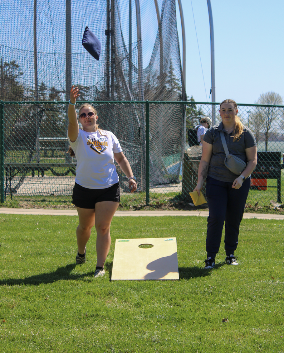 Geneva Galler, left, plays cornhole with Madison Lindaman on Thursday, April 16, 2026.